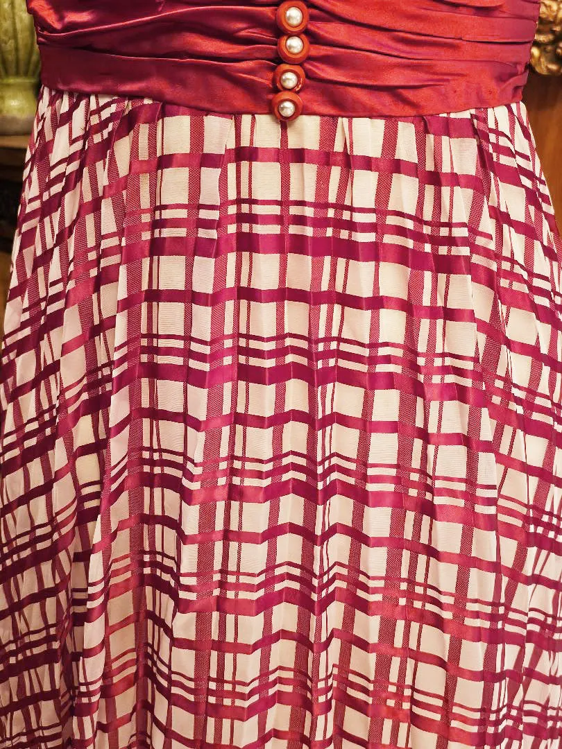 VINTAGE LATE 1960S EARLY 1970S RED AND WHITE PLAID PLEATED EVENING GOWN WITH RUCHED CUMMERBUND & PEARL BUTTONS